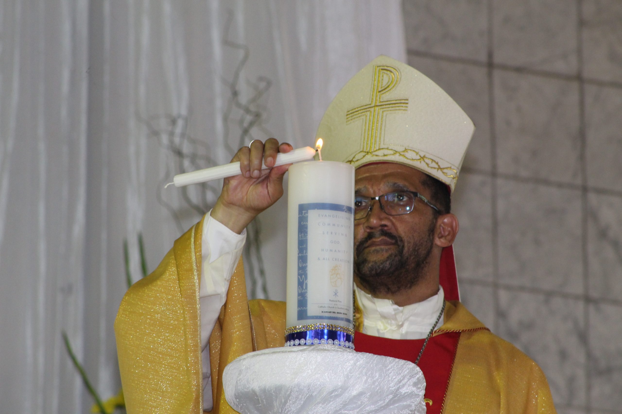 SACBC President Bishop S. Sipuka lights the SACBC Pastoral Plan Launch.