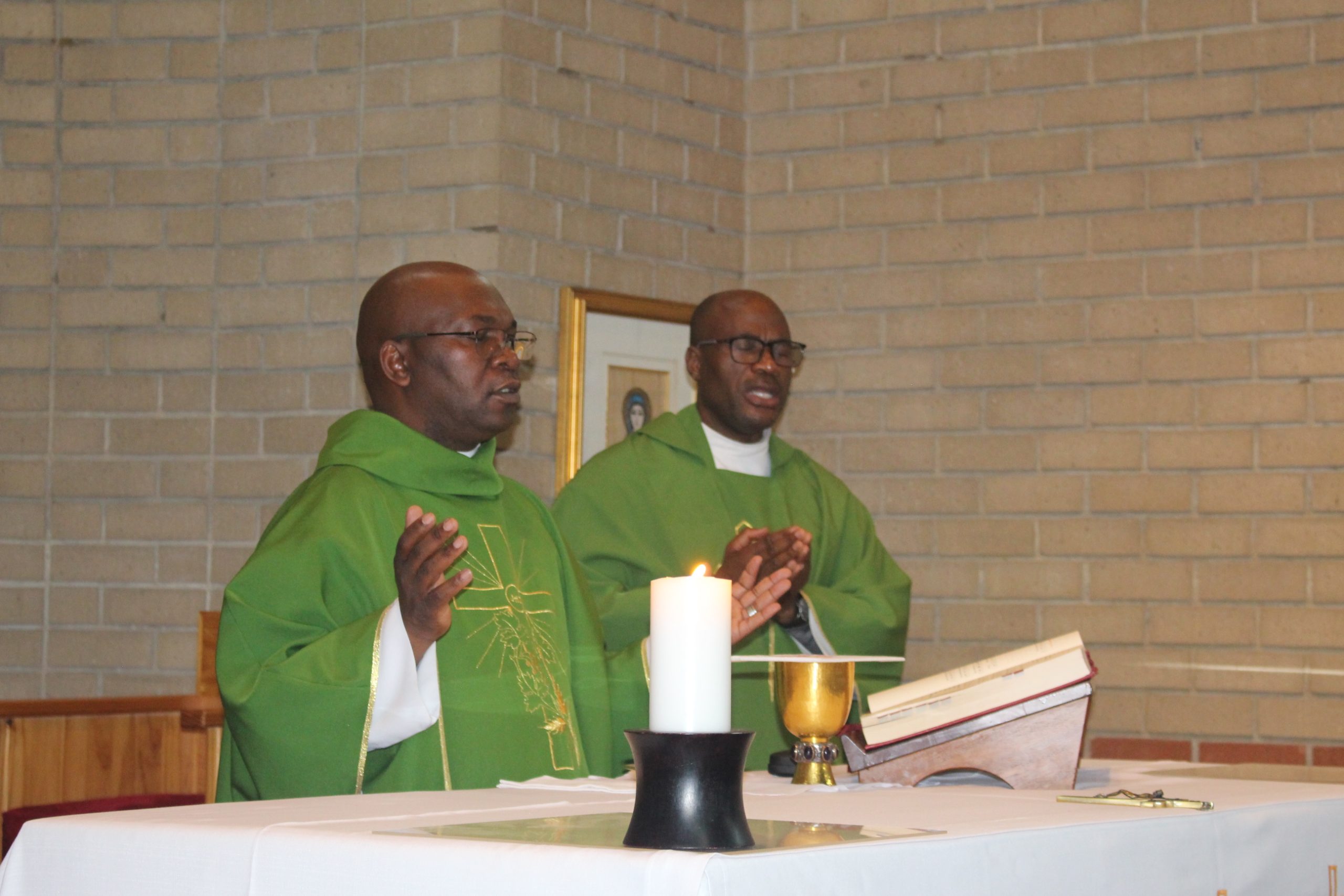 Fr.s blessing the sacriment